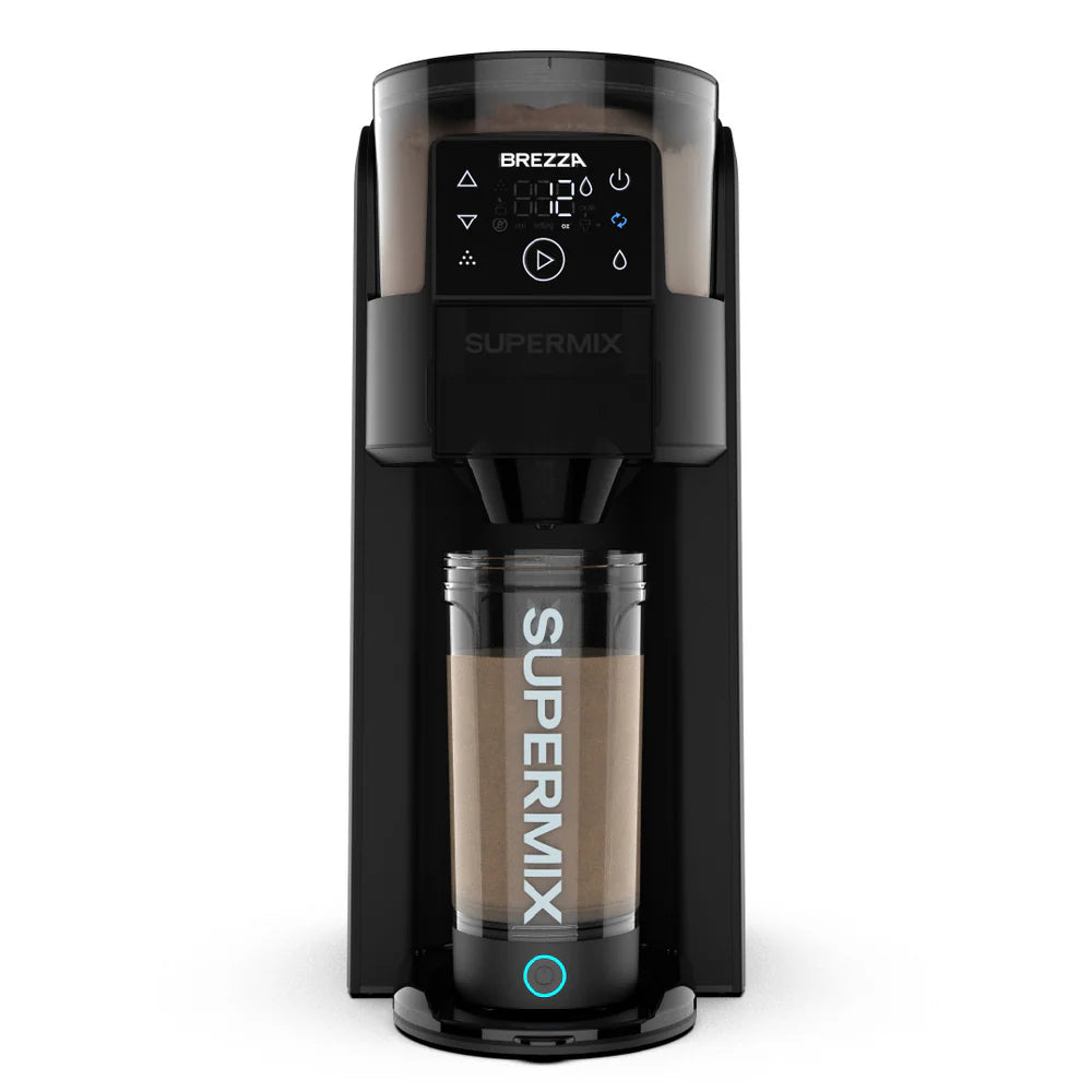 Front view of the Brezza Supermix protein shake maker – sleek, black countertop appliance designed for effortless protein shakes. Filled with chocolate protein powder and showing a smooth chcolate protein shake in the automatic mixing cup
